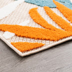 Tapis d'intérieur/extérieur à motif floral côtier Origin.