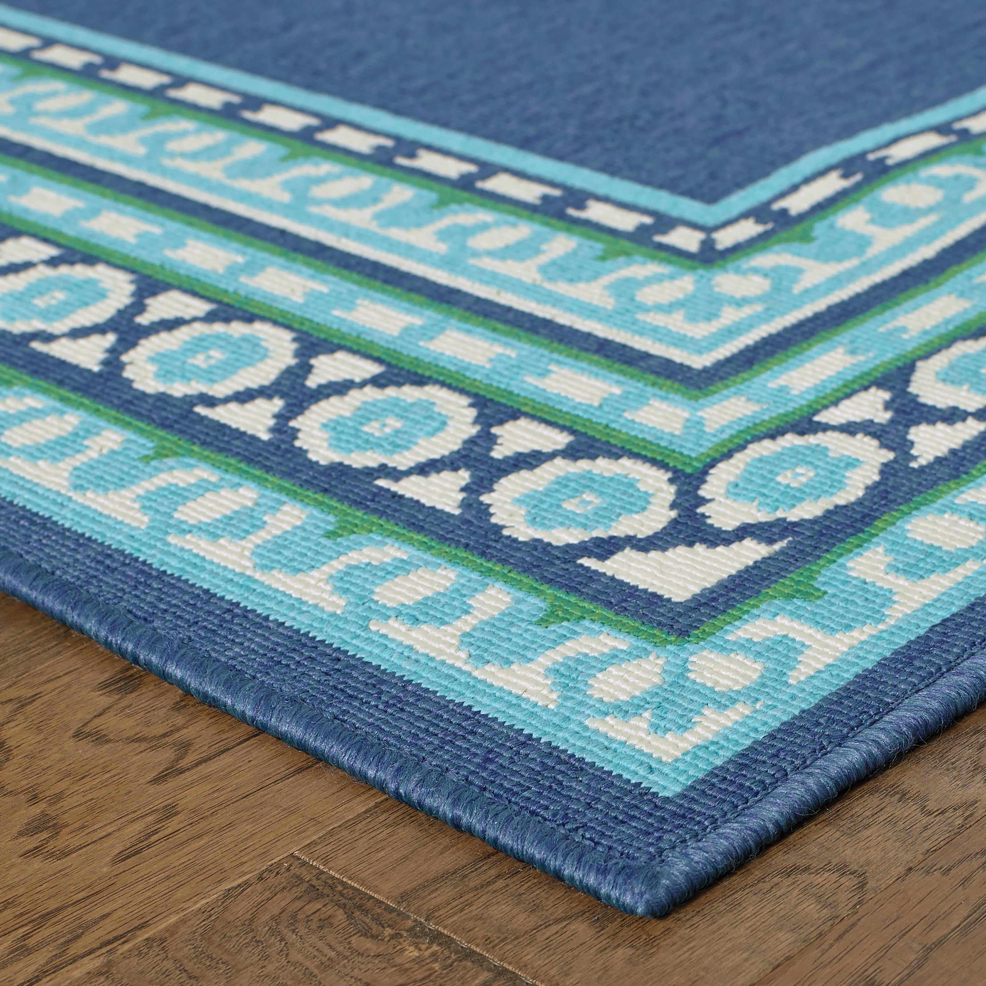 Tapis d'intérieur/extérieur Style Haven Martinque à bordure verte bleu marine ~
