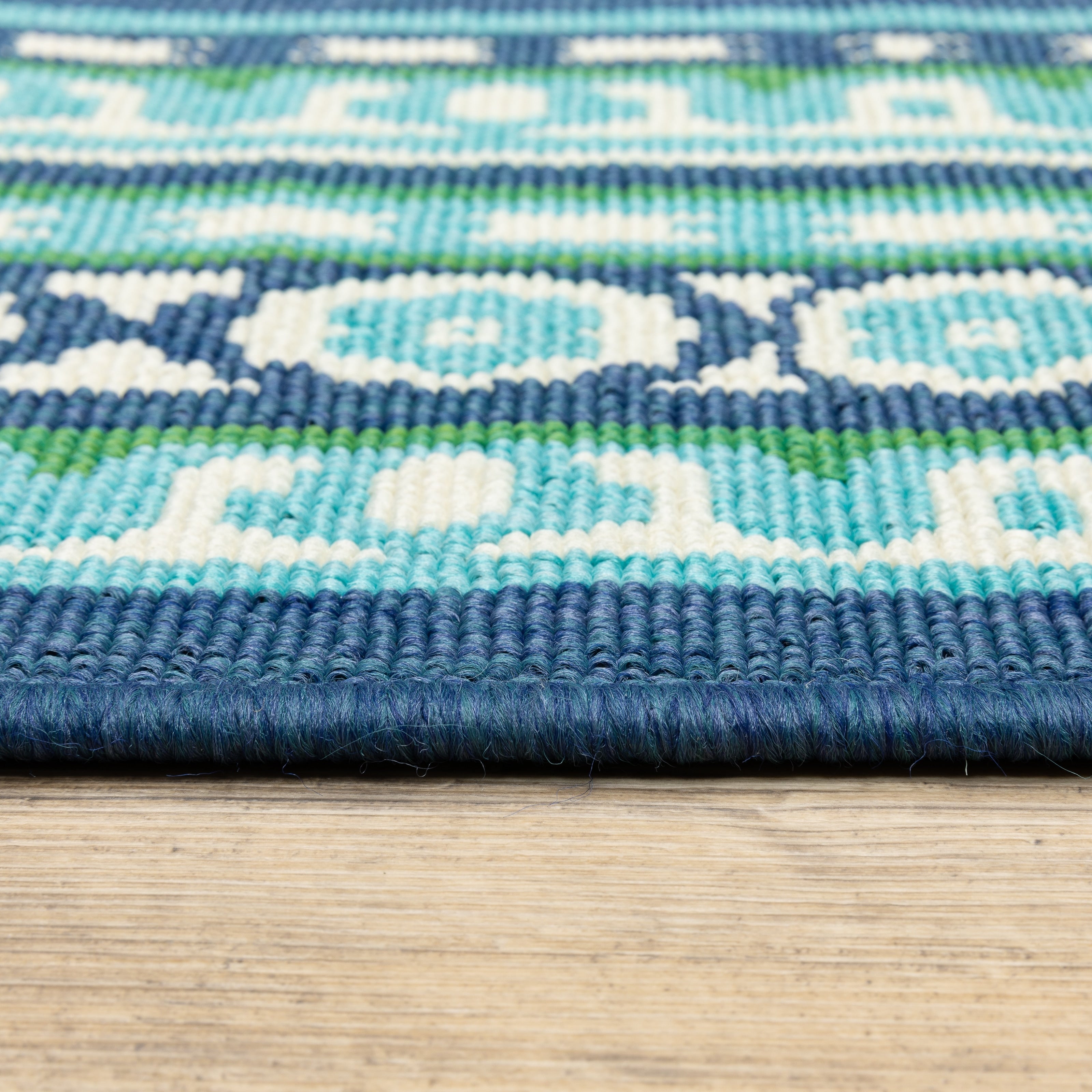 Tapis d'intérieur/extérieur Style Haven Martinque à bordure verte bleu marine ~